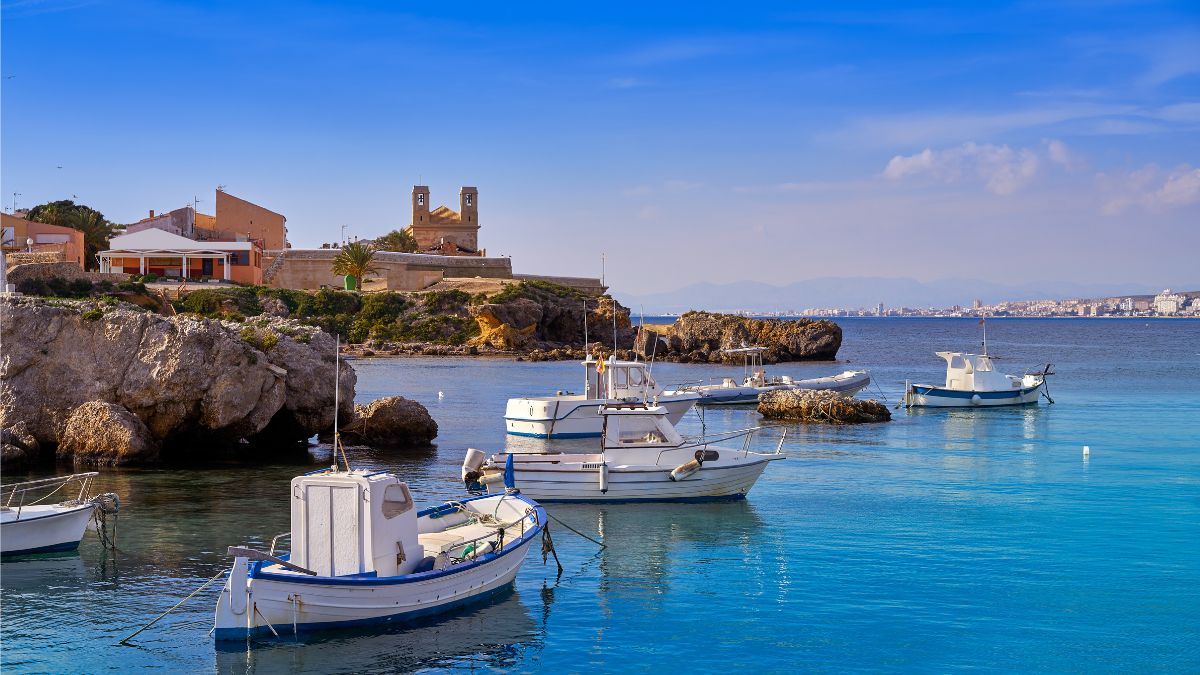Tabarca Island — fishing boats in a crystal-clear cove